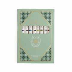 Set of calliographs in a decorative green box with geometric patterns