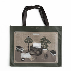 Olive green tote bag illustrated with vintage typewriter and writer's desk scene